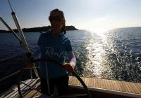 sailing yacht skipper woman steering wheel sailing yacht